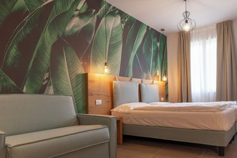 Triple Room | Down comforters, in-room safe, desk, free WiFi