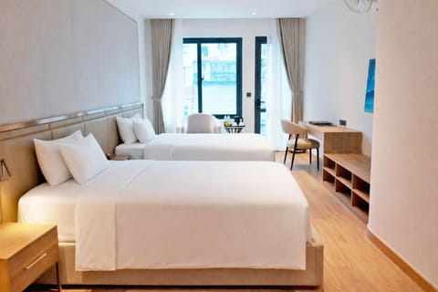 Premium Double Room Single Use, Multiple Beds, City View | Minibar, in-room safe, desk, blackout drapes