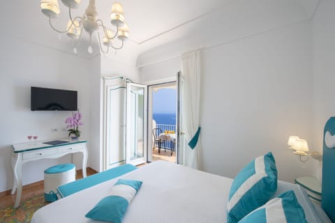 Standard Triple Room, Terrace, Sea View | Down comforters, in-room safe, desk, laptop workspace