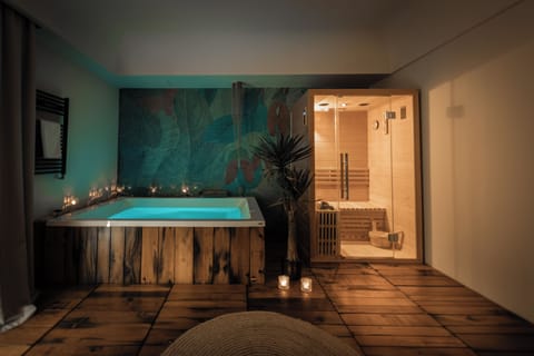 Deluxe Suite, 1 King Bed, Sauna, Courtyard View | Down comforters, minibar, in-room safe, desk