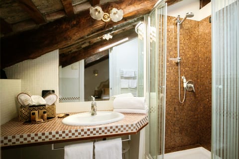 Superior Room | Bathroom | Rainfall showerhead, hair dryer, slippers, bidet