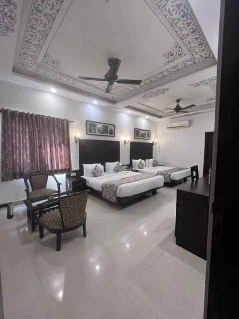 Family Room, 2 Queen Beds | Select Comfort beds, minibar, in-room safe, individually decorated