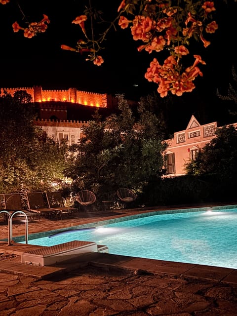 Seasonal outdoor pool, open 9:00 AM to 9:00 PM, pool umbrellas