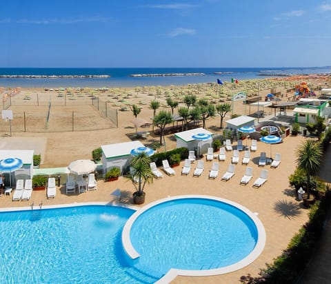 Seasonal outdoor pool, open 8:00 AM to 7:00 PM, pool umbrellas