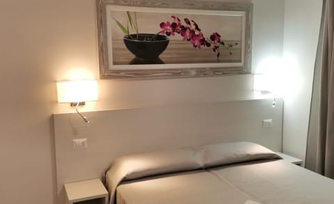 Economy Double Room | Down comforters, minibar, in-room safe, desk