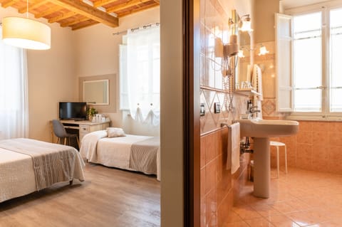 Triple Room | Minibar, desk, iron/ironing board, free cribs/infant beds