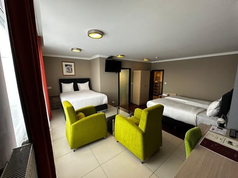 Standard Quadruple Room, Multiple Beds, Non Smoking | In-room safe, desk, laptop workspace, soundproofing