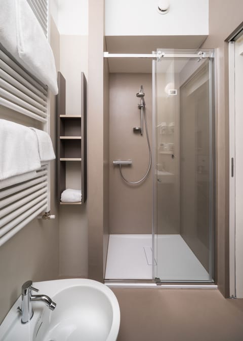 Shower, free toiletries, hair dryer, slippers