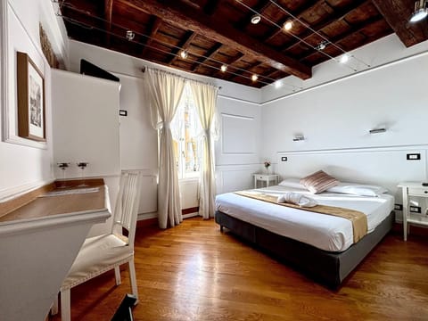 Double Room | Minibar, in-room safe, desk, iron/ironing board