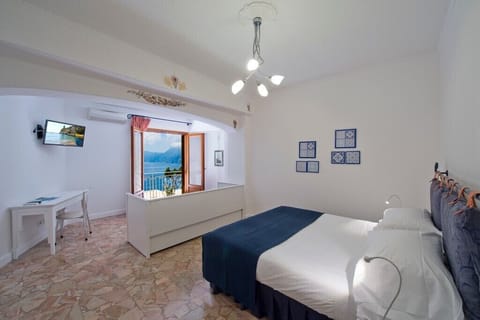 Superior Room, Sea View | Minibar, in-room safe, iron/ironing board, free WiFi