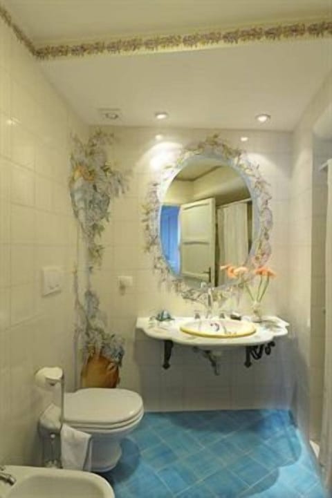 Shower, hair dryer, slippers, towels