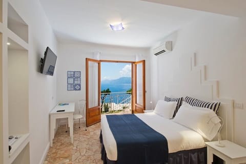 Superior Room, Sea View | Minibar, in-room safe, iron/ironing board, free WiFi