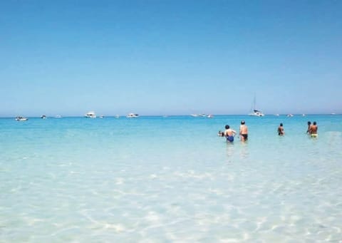 Private beach, white sand, sun loungers, beach umbrellas