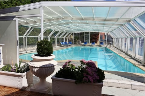 Seasonal outdoor pool, open 10:00 AM to 7:00 PM, sun loungers