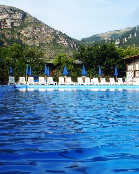 Seasonal outdoor pool, pool umbrellas, sun loungers