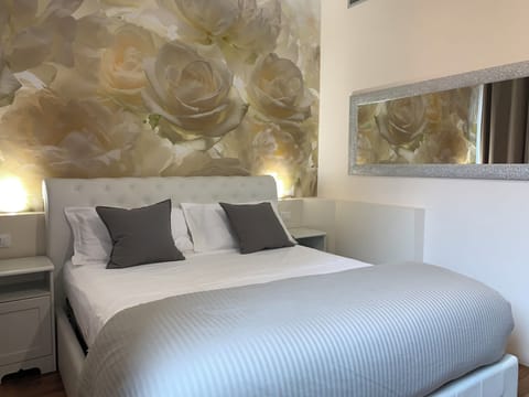 Desk, laptop workspace, blackout drapes, iron/ironing board