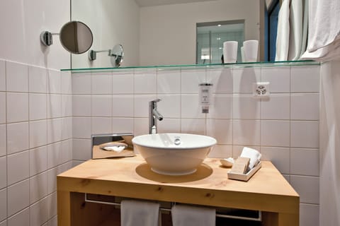 Premium bedding, down comforters, pillowtop beds, in-room safe