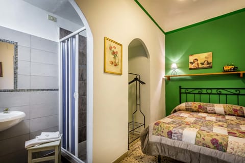 Economy Double Room, Shared Bathroom | Desk, laptop workspace, free WiFi, bed sheets