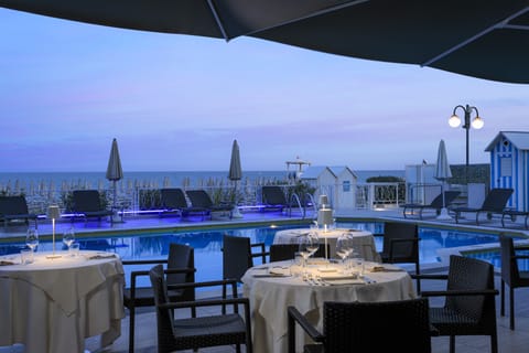 Breakfast, lunch, dinner served; Italian cuisine, pool views 