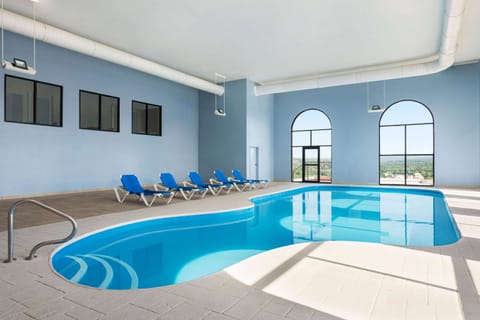 Indoor pool, open 10:00 AM to 10:00 PM, sun loungers