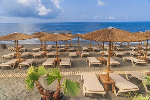 On the beach, sun loungers, beach umbrellas, beach towels