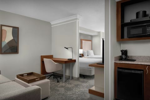Premium bedding, desk, laptop workspace, iron/ironing board