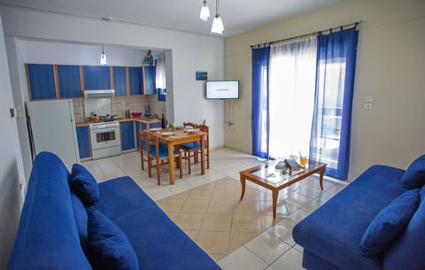 Apartment (4 Adults) | Living area | 32-inch flat-screen TV with digital channels, TV