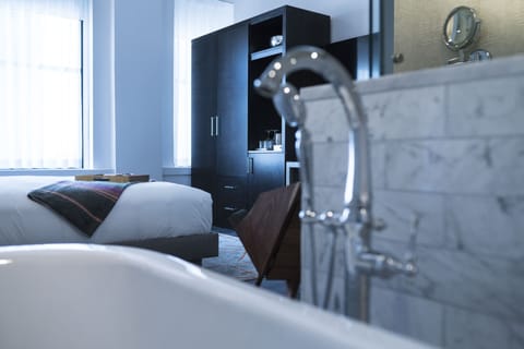 Shower, designer toiletries, hair dryer, bathrobes