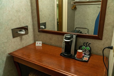 Desk, laptop workspace, blackout drapes, iron/ironing board