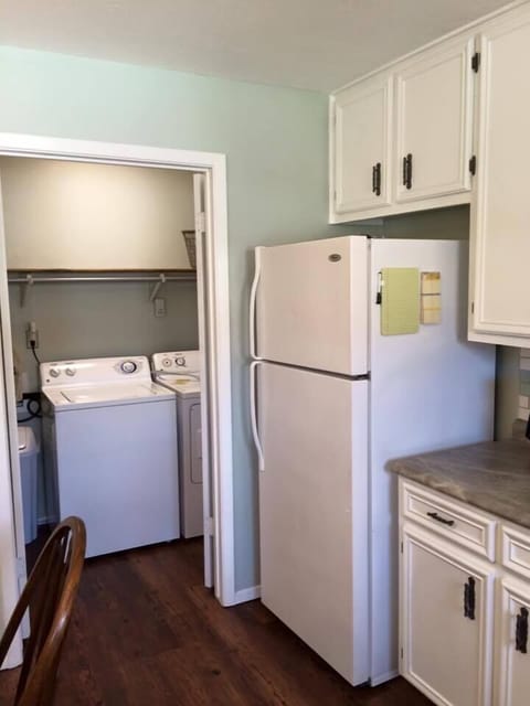 Washer and dryer right off kitchen.  Detergent provided.