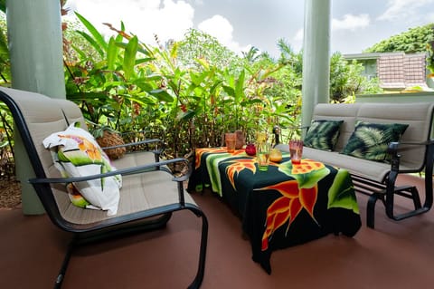 Puamana 25B | Kauai vacation rentals | Princeville condos 1 - The shaded front porch at Puamana 25B is the perfect spot for enjoying a peaceful breakfast in the morning sunshine, or unwinding with a nice glass of wine while watching the sunset!