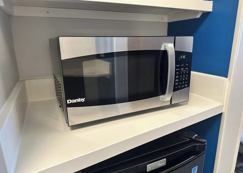 Desk, laptop workspace, blackout drapes, iron/ironing board