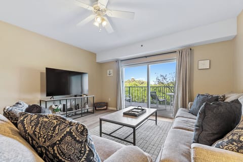 Spacious living room with a flat-screen TV.