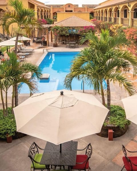 Outdoor pool, pool umbrellas, sun loungers