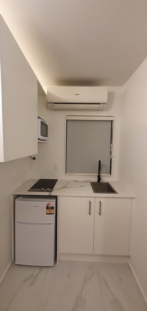 Fridge, coffee/tea maker, toaster, cookware/dishes/utensils