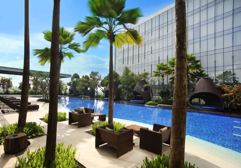 Outdoor pool, open 6 AM to 10:00 PM, free cabanas