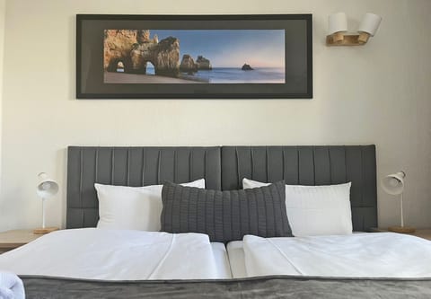 Hypo-allergenic bedding, pillowtop beds, desk, blackout drapes