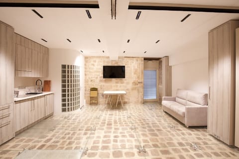 Spacious living-room with queen-size sofa-bed and dining table