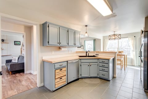 The kitchen opens to both living rooms and the dining room.
