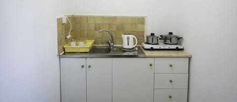 Fridge, stovetop, electric kettle, cookware/dishes/utensils