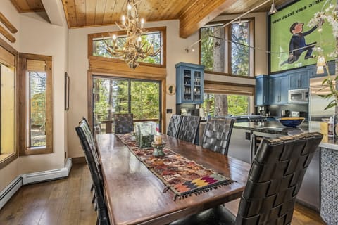 Tastefully decorated dining and kitchen with French subway art