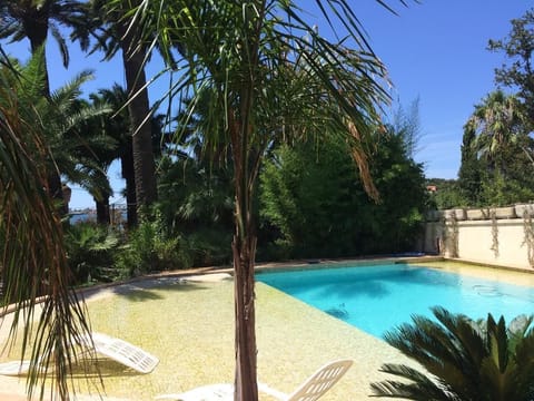 Seasonal outdoor pool, open 10:30 AM to 6:30 PM, pool umbrellas