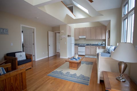 The second living room is complete with kitchen, tv and is set up to relax in wh