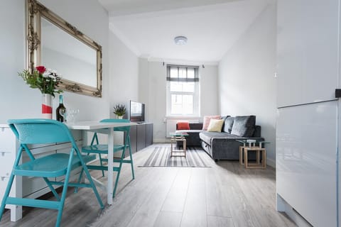 Apartment, 4 Bedrooms | Living area | Flat-screen TV