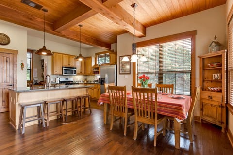 Dining table will seat 8 and island will seat 4. A high chair is in the closet.