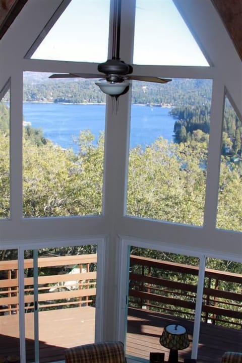 Looking down from the loft into the living room area out towards the lake.