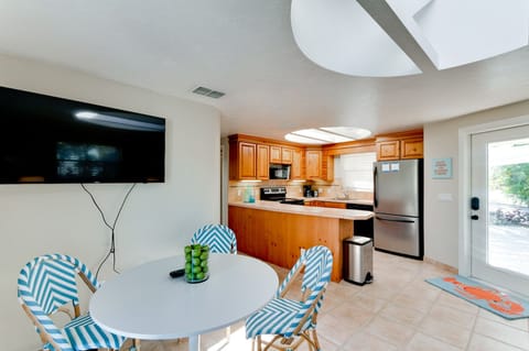 Anna Cabana A kitchen & front door entry view from living room