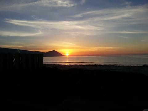 Experience sunsets like this from the deck of your beach rental.