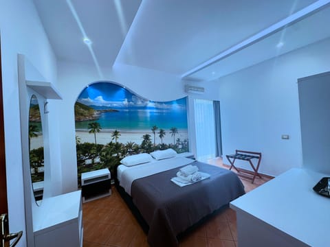 Deluxe Triple Room, Sea View | In-room safe, desk, soundproofing, iron/ironing board