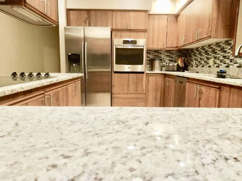 Beautiful kitchen fully stocked to cook and serve for everyone. Grill on patio.